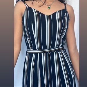 Women’s small body suit ish dress. Wide and slit at the end.